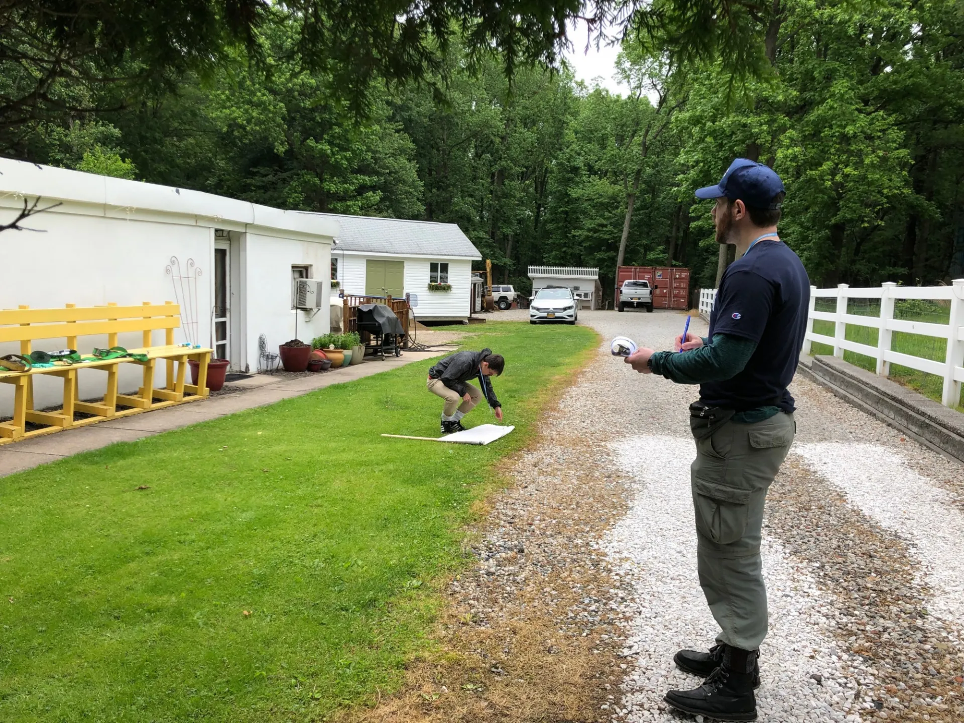 students surveying and sampling for ticks in the yard